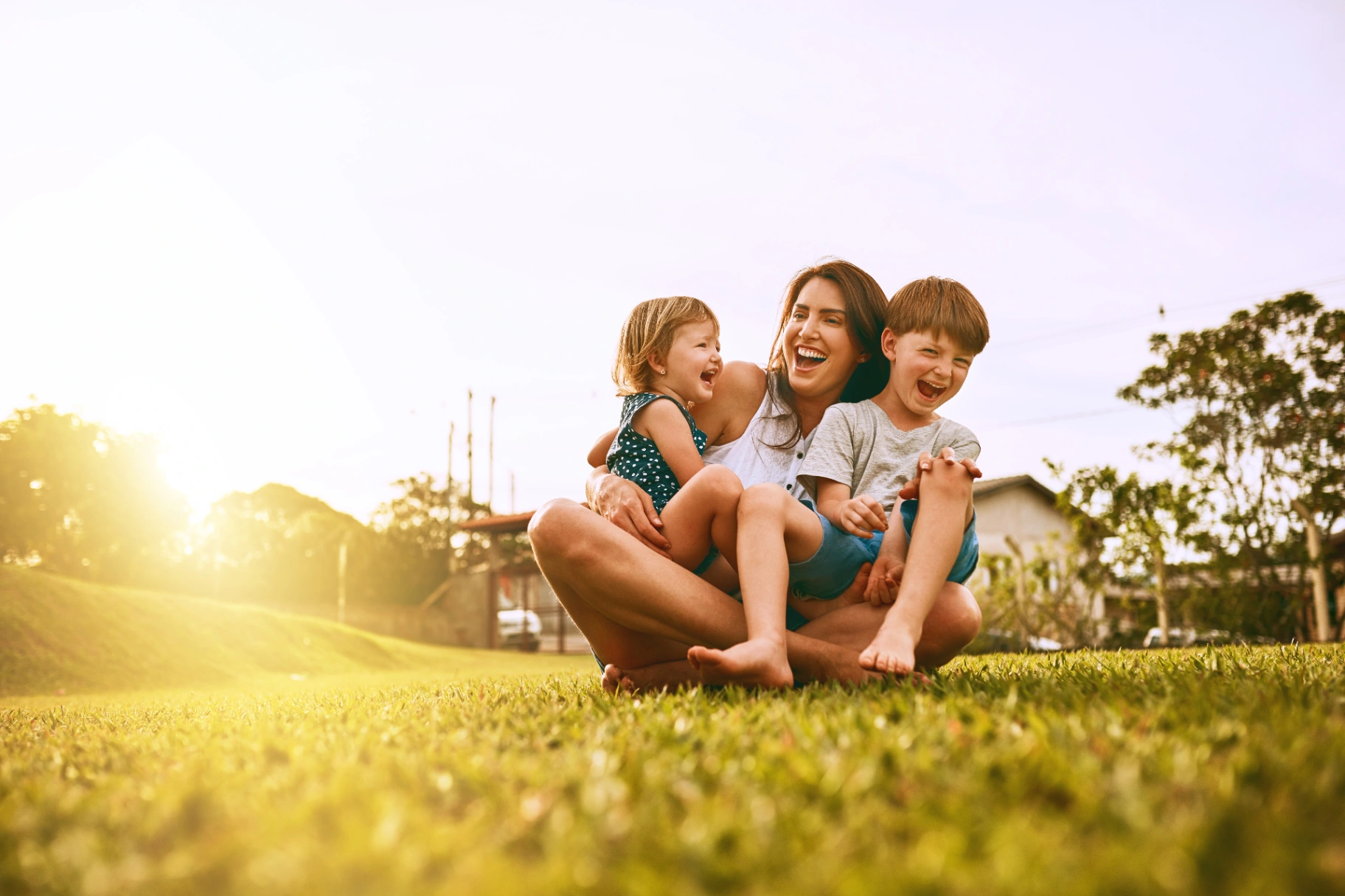 Mother laughing with her children